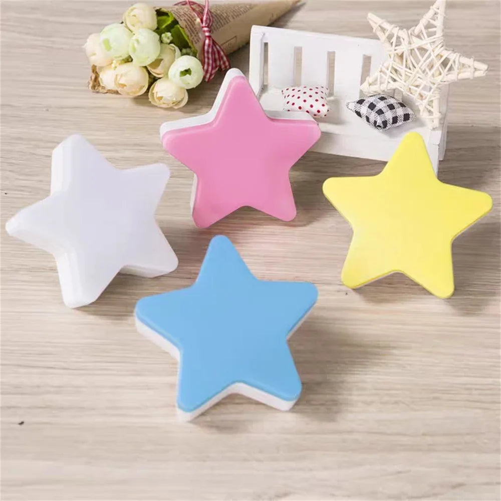 Set of colorful star LED plug-in night lights: white, pink, yellow, and blue stars.