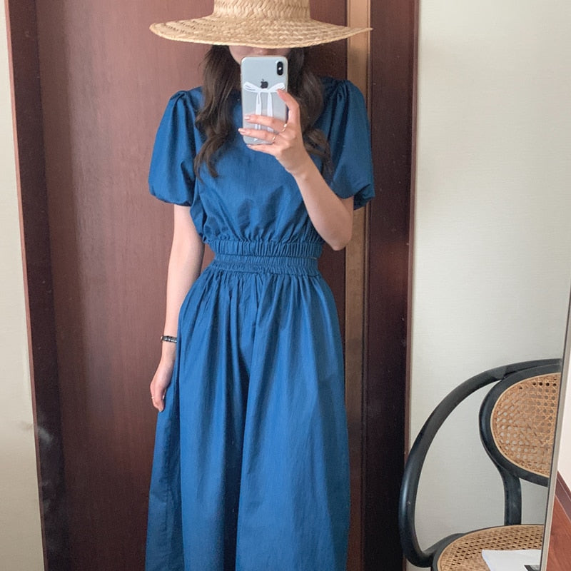 Women’s dark blue denim puff-sleeve top with gathered elastic waist and midi skirt
