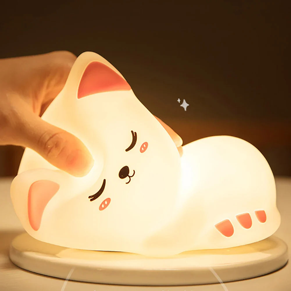Sleepy kitty night light, glowing white cat lying on its side