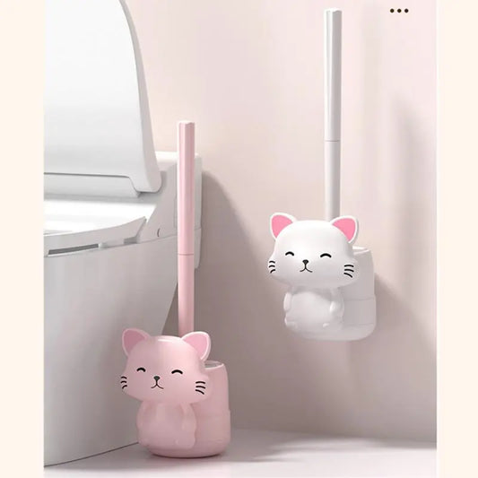 Pink cat-shaped wall toilet brush with vertical handle and rounded base.