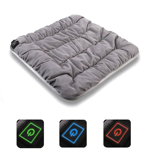 Gray adjustable electric heating pad cushion with control module on the corner.
