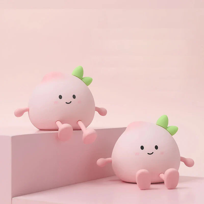 Pair of white fruit-shaped cute night lights with green leaves, smiling faces