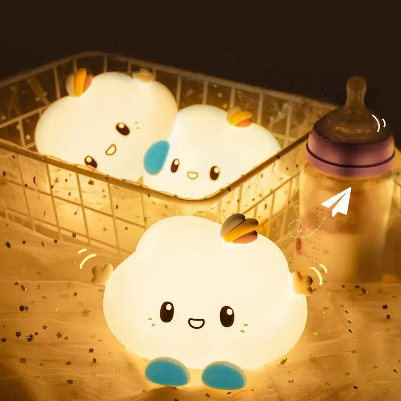 Set of three glowing cloud LED night lights with smiling faces and rainbow accents