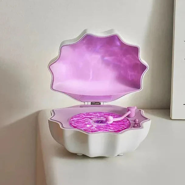 Purple shell Bluetooth speaker night light, open lid with glowing purple light panel