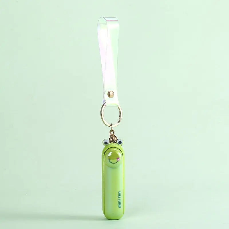 Light green animal-shaped handheld fan keychain with clear ribbon strap