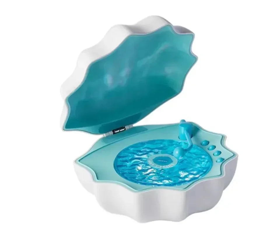 Blue shell Bluetooth speaker night light, open lid showing glowing blue light panel