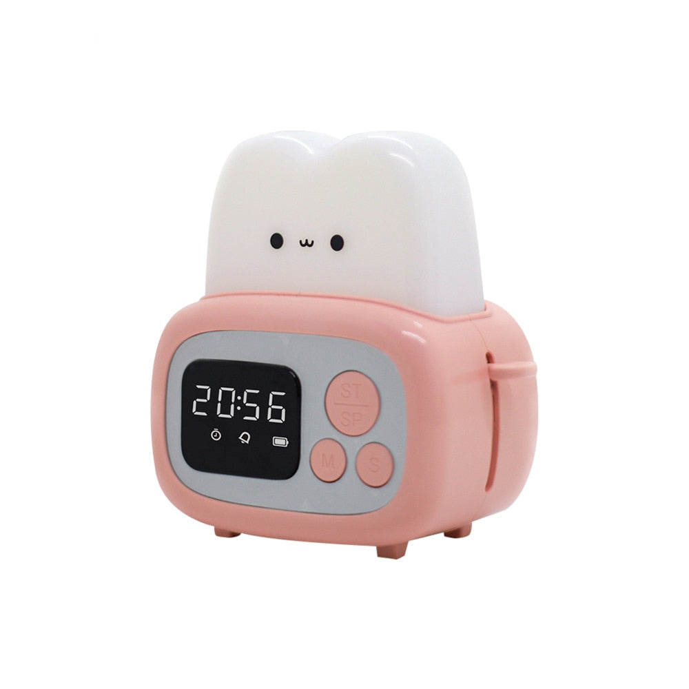 Pink toaster-shaped alarm clock night light with 20:56 time display and buttons