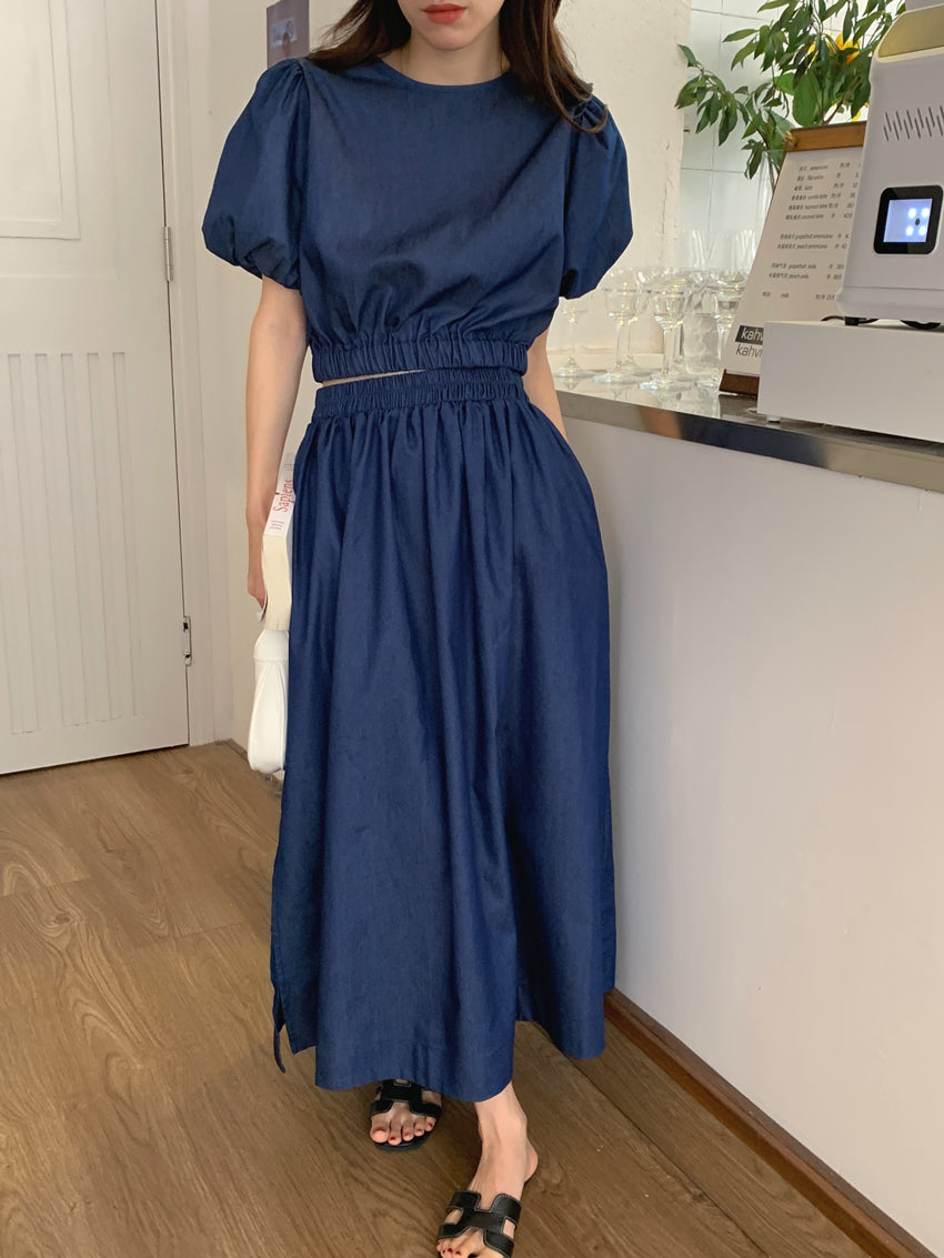 Women’s blue denim puff-sleeve crop top with elastic waist and long gathered midi skirt