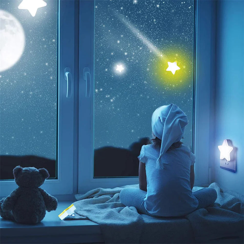 Blue star LED plug-in night light glowing beside a wall outlet in a bedroom.