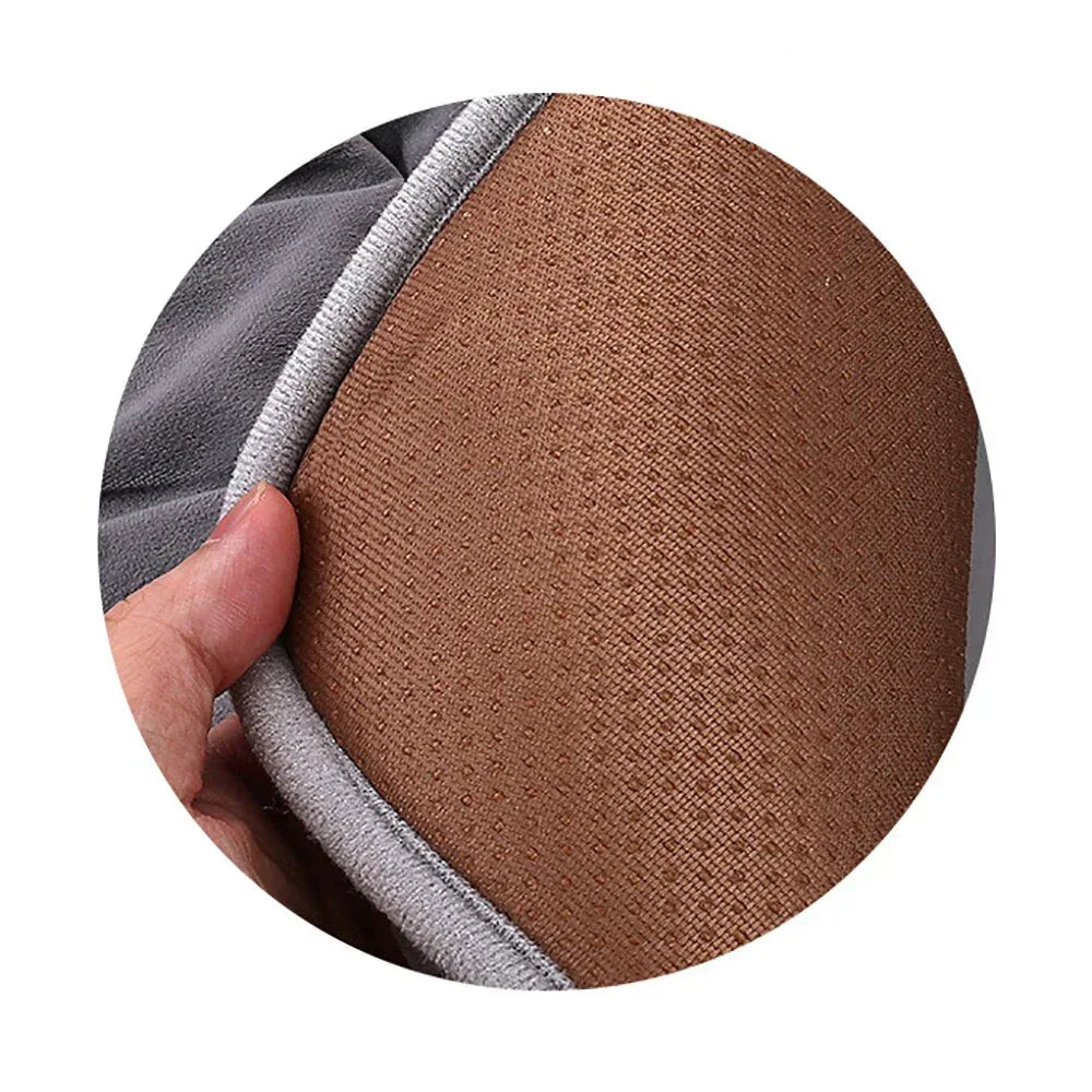 Brown heating pad cushion fabric with stitched edge trim and folded corner.