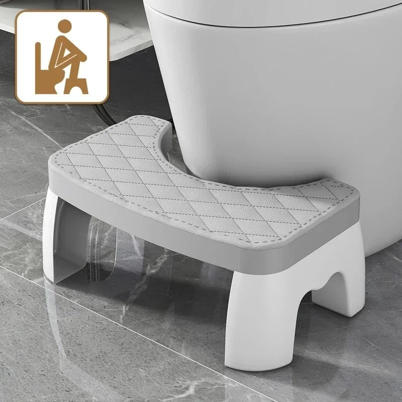 Grey toilet squat stool with quilted non-slip removable seat cushion, U-shaped cutout