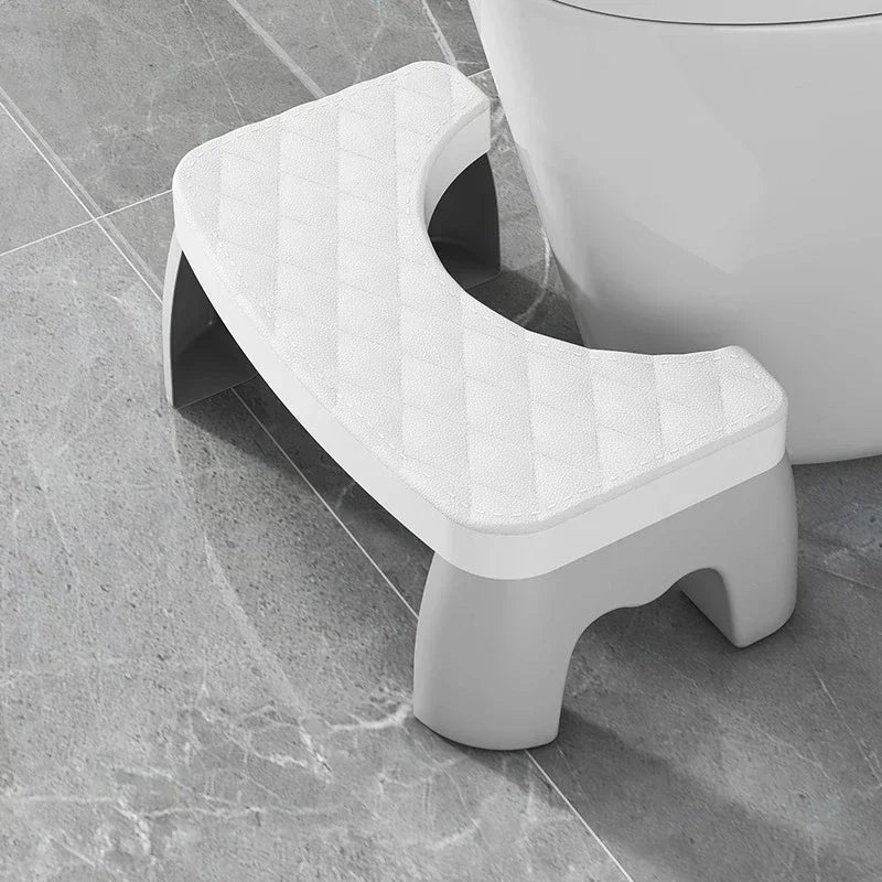 White toilet squat stool with quilted non-slip seat cushion and U-shaped cutout