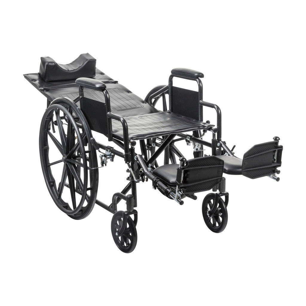 Reclining wheelchair with desk arms, padded black seat, extended leg support and footrest
