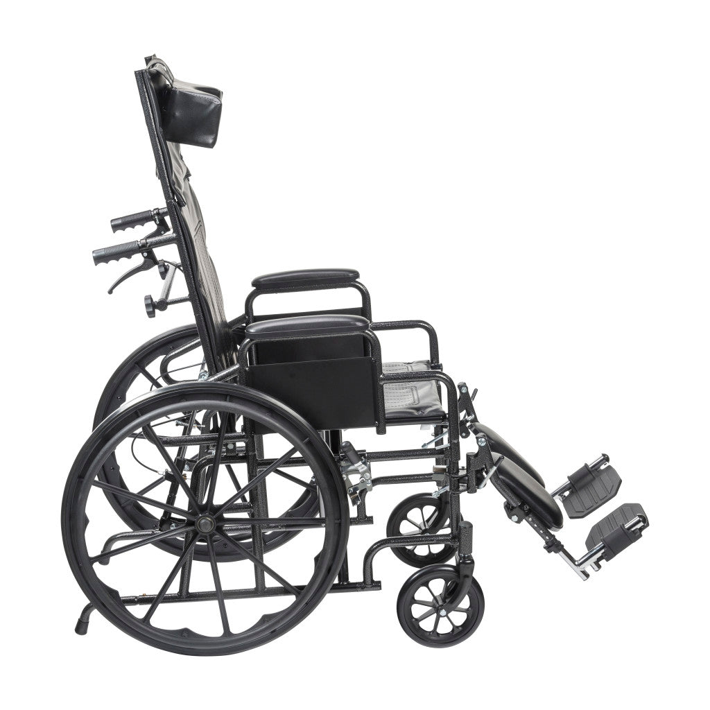 Side view full-reclining wheelchair with desk arms, padded black seat, footrests