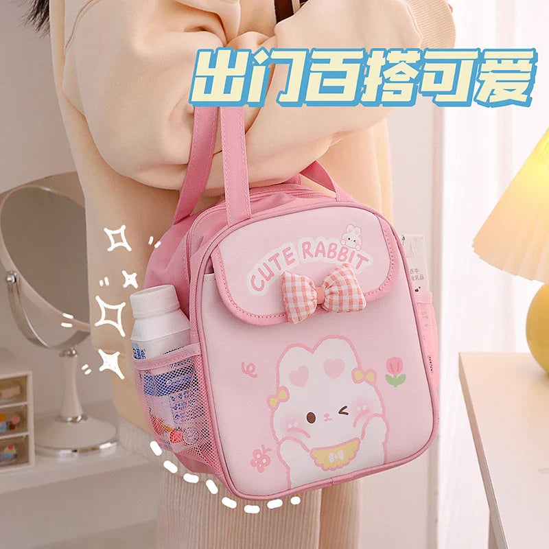 Pink insulated lunch bag with cute rabbit front pouch, bow and carry handle