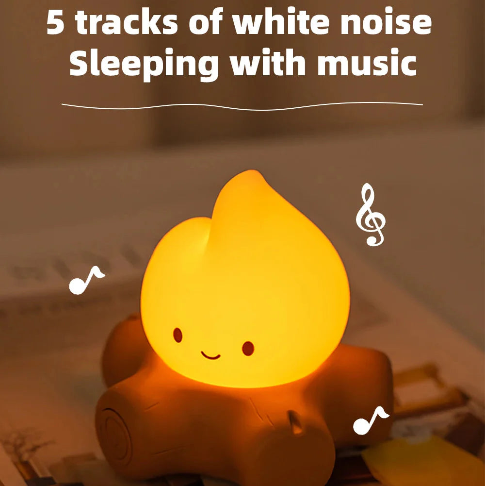 Warm glowing campfire night light with smiling flame on brown log