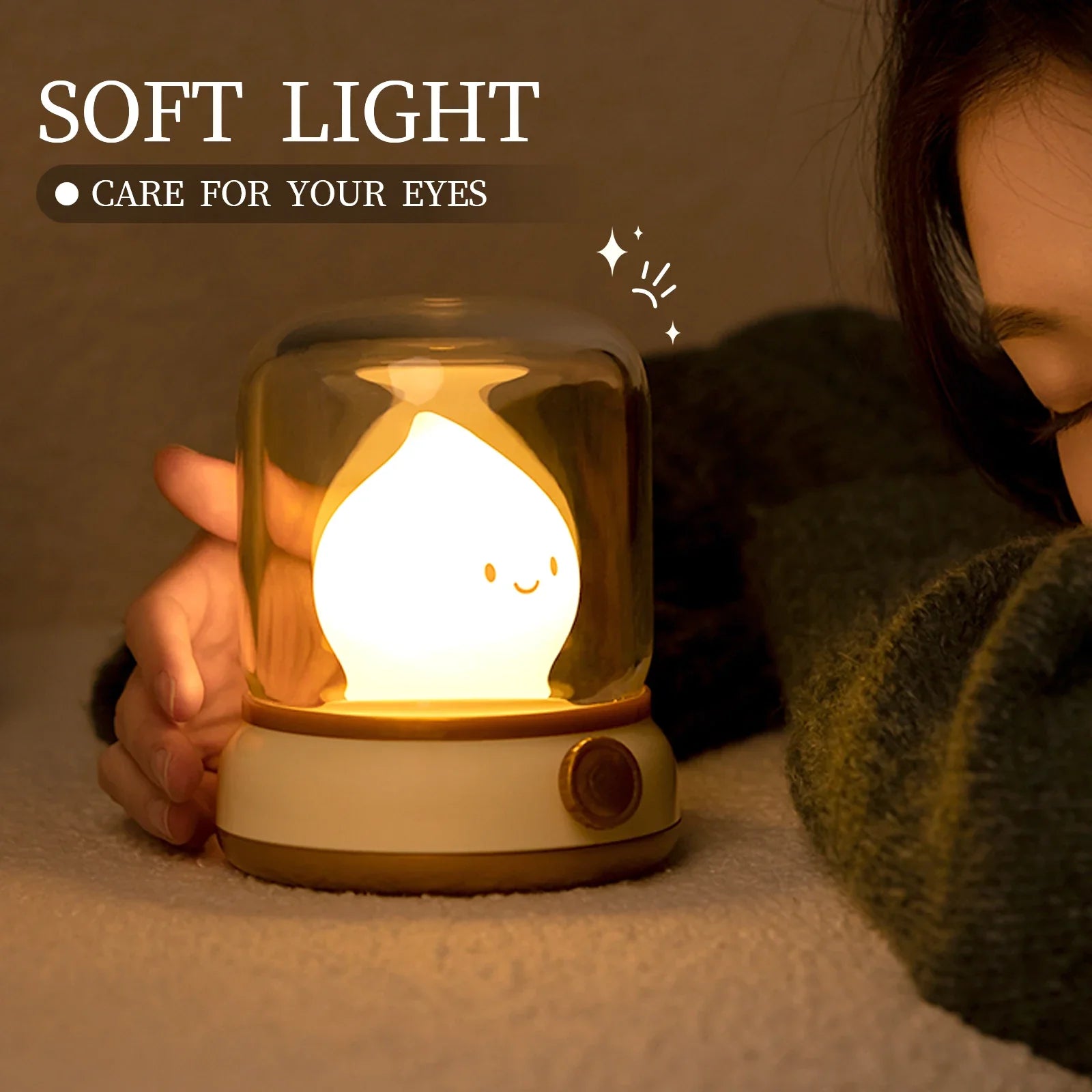 Green flame lantern night light held near face, clear dome with glowing flame character.