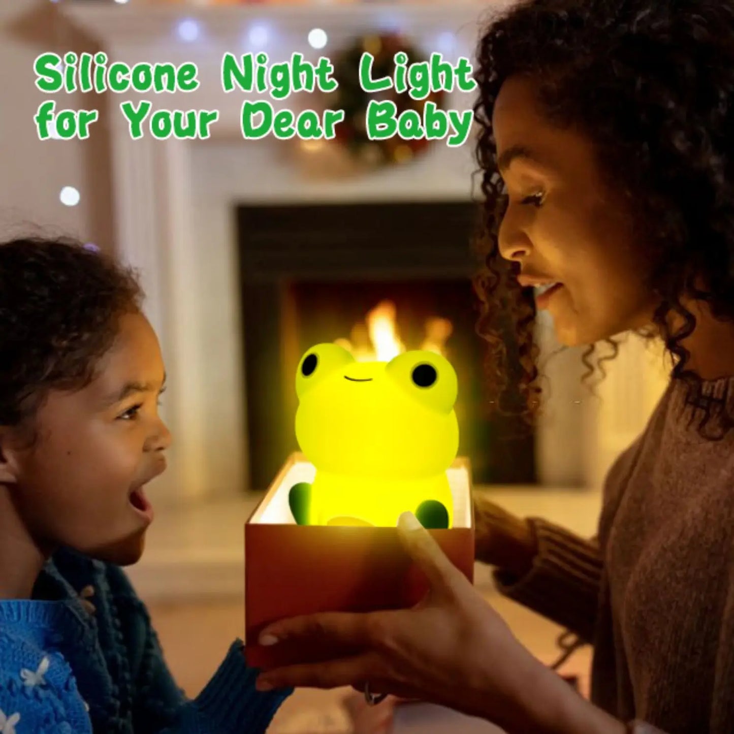 Glowing yellow frog-shaped silicone night light being held in a box.