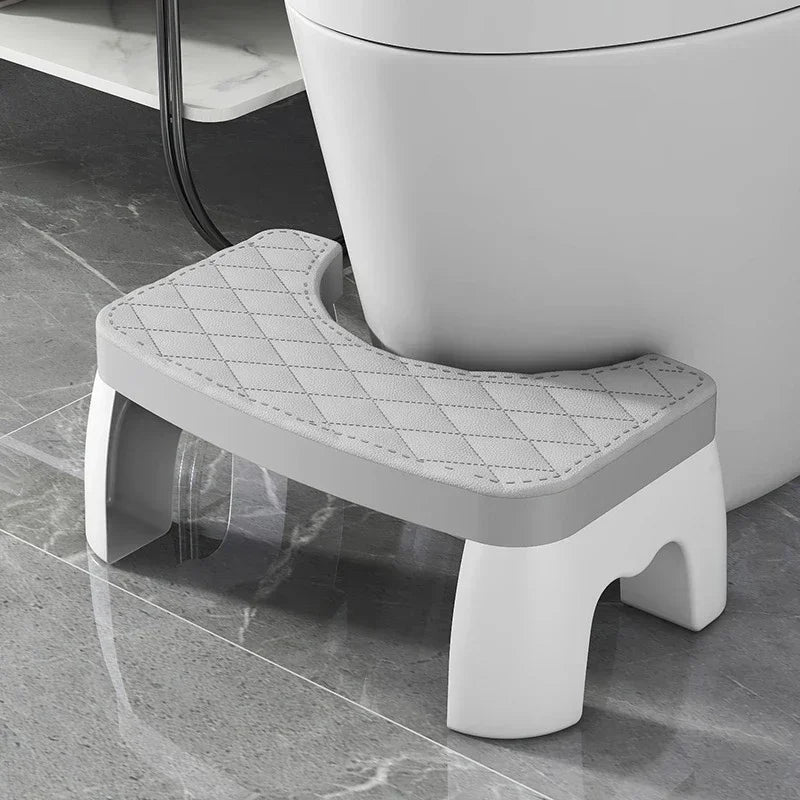 Grey toilet squat stool with quilted non-slip removable seat cushion, U-shaped cutout