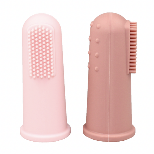 Two pink silicone cleaning brushes on a white background