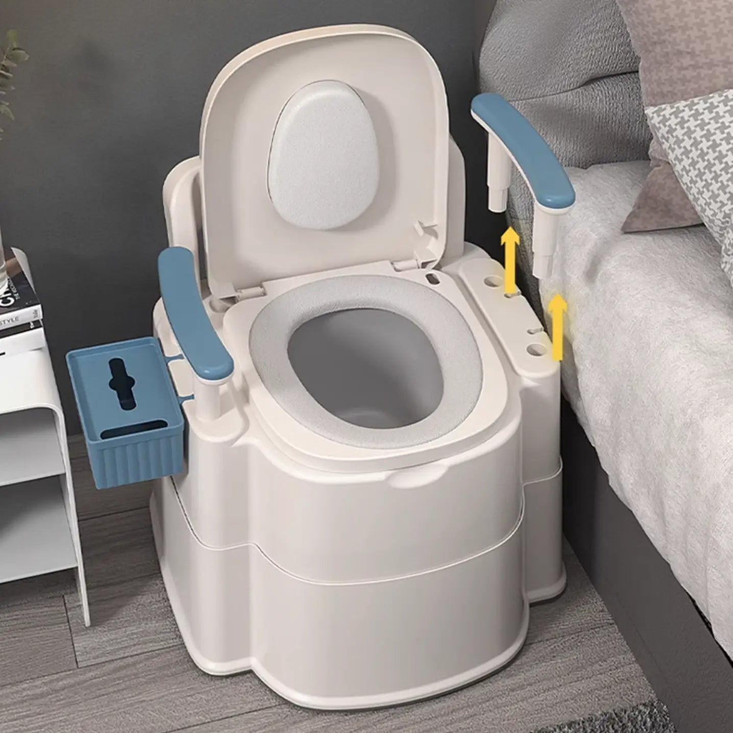 White bedside commode chair with open lid, round seat opening, and raised armrests