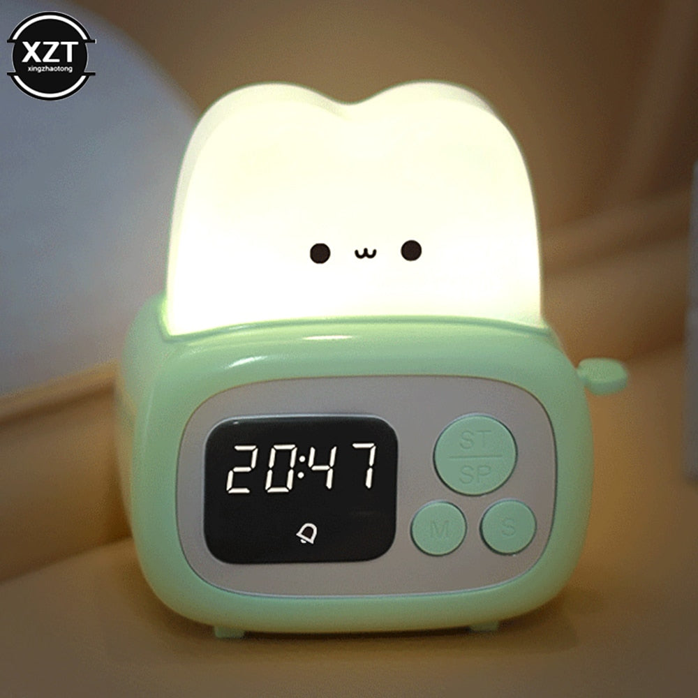 Green toaster-shaped alarm clock night light, illuminated top, 20:47 time shown