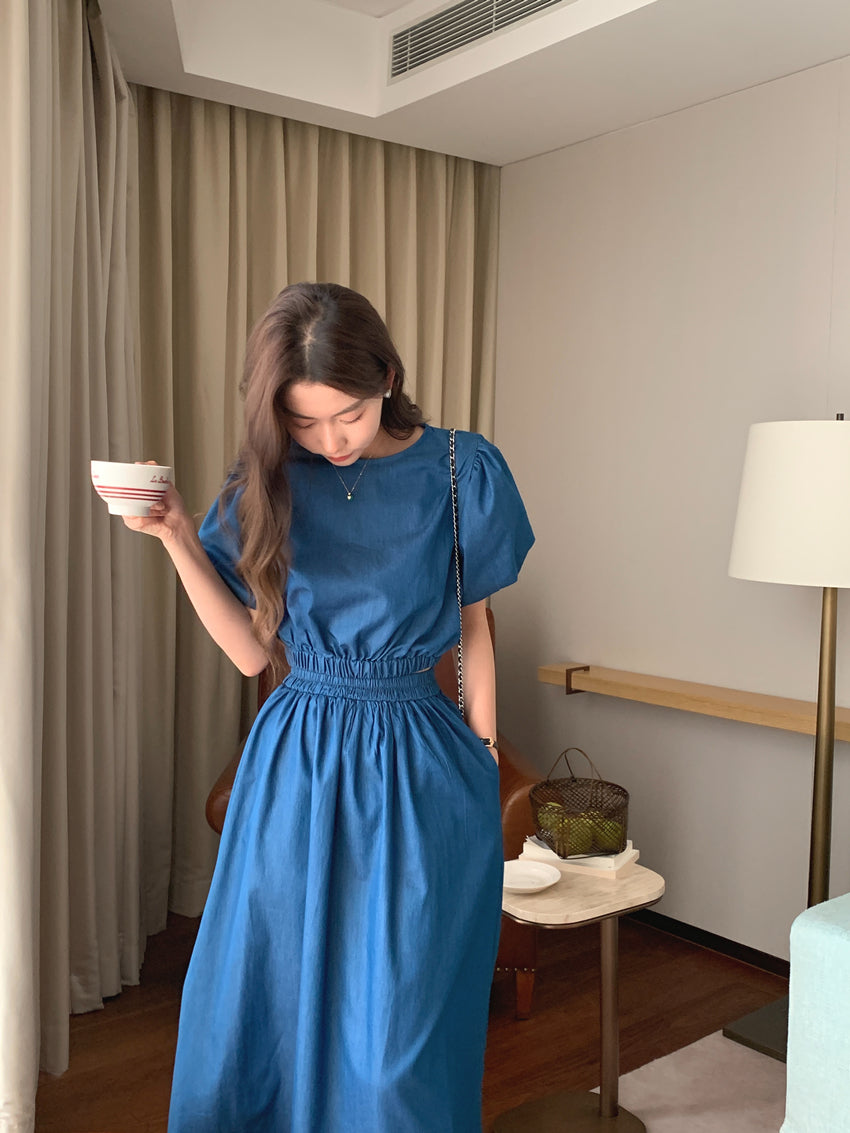 Blue denim puff-sleeve top and gathered midi skirt set with cinched waist
