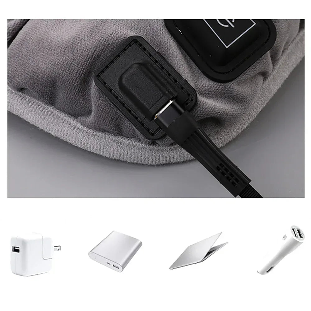 Gray heating pad showing the embedded control switch with attached power cord.