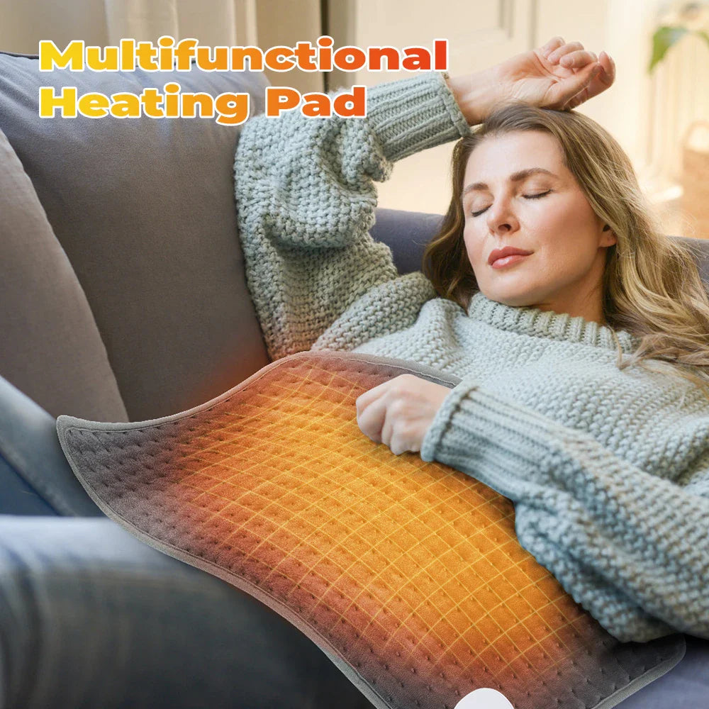 Gray electric heating blanket pad with orange heat grid surface and cord