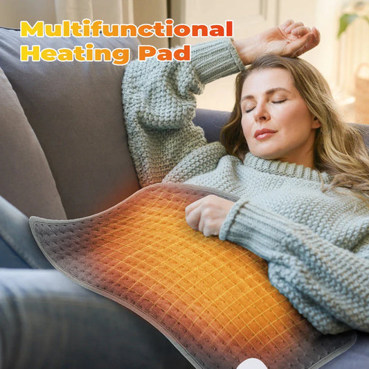Gray electric heating blanket pad with orange heat grid surface and cord