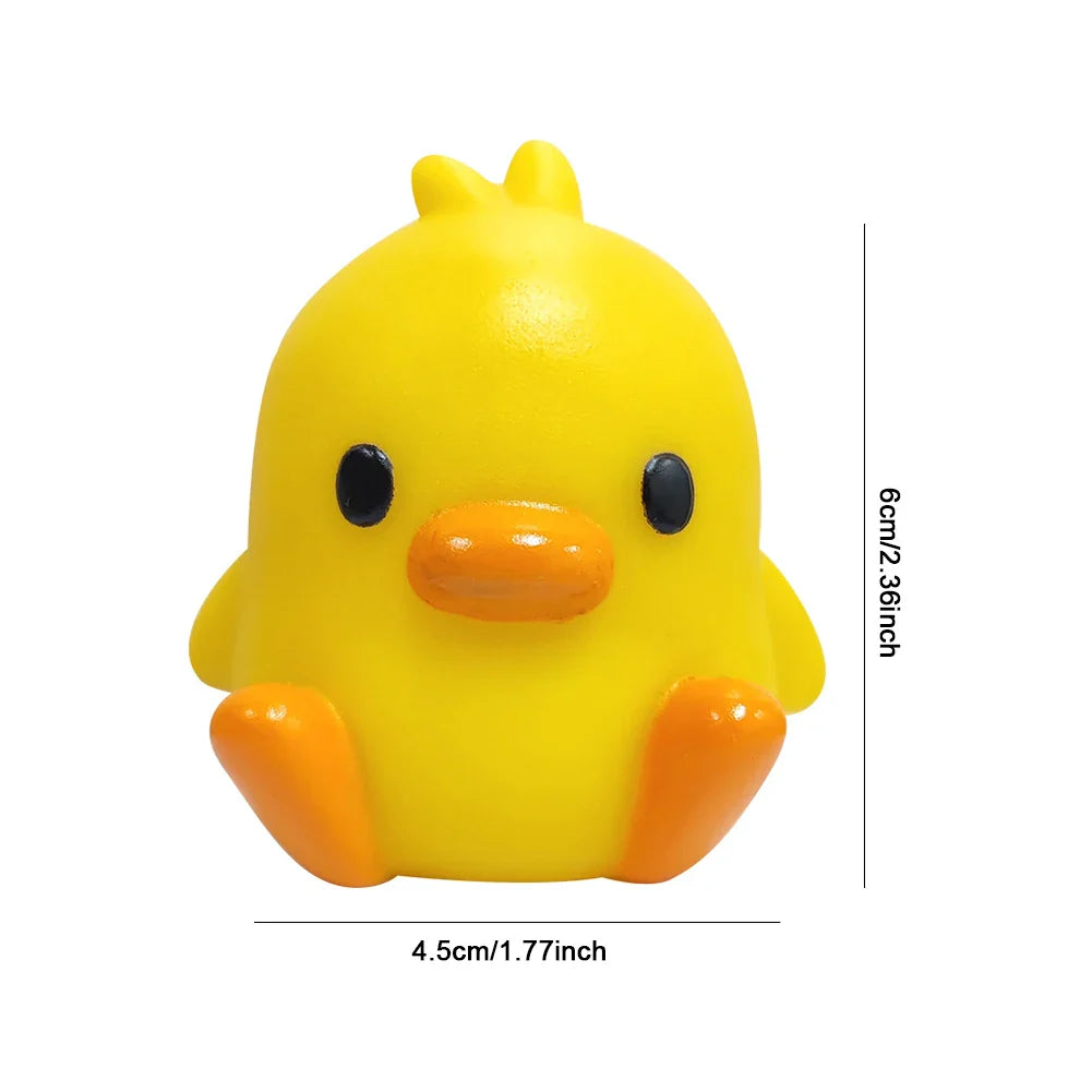 Yellow duck night light with orange beak and black eyes, rounded cute design