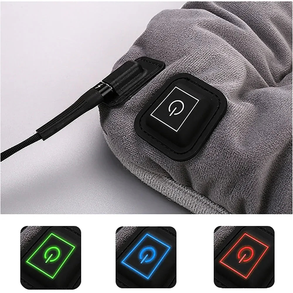 Gray heating pad controller with glowing power icon and connected cable.