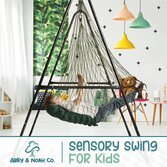 Green kids hammock chair swing with woven rope, child lying back inside.