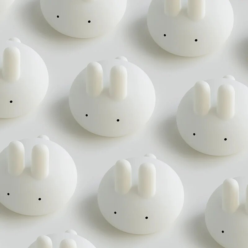 Set of white bunny night lights with upright ears and dot eyes