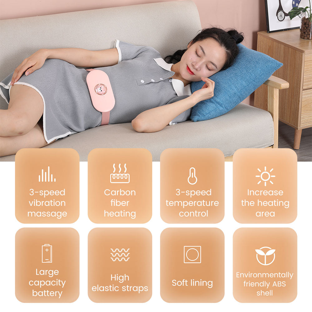 Pink electric heating pad belt resting on lower back over sleepwear