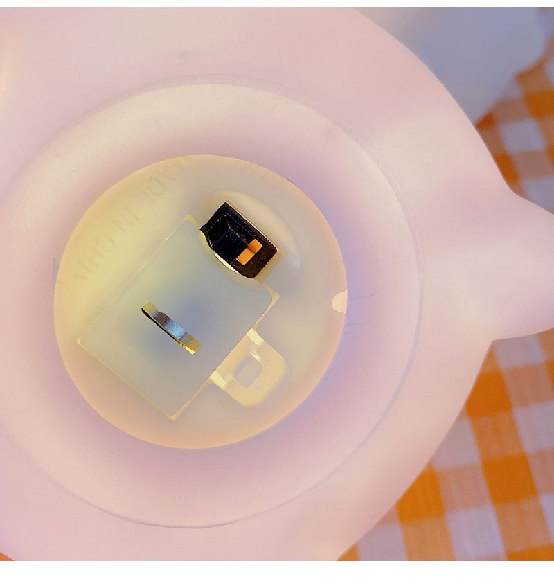 Happy Bunny night light interior, round diffuser with visible LED and metal contacts