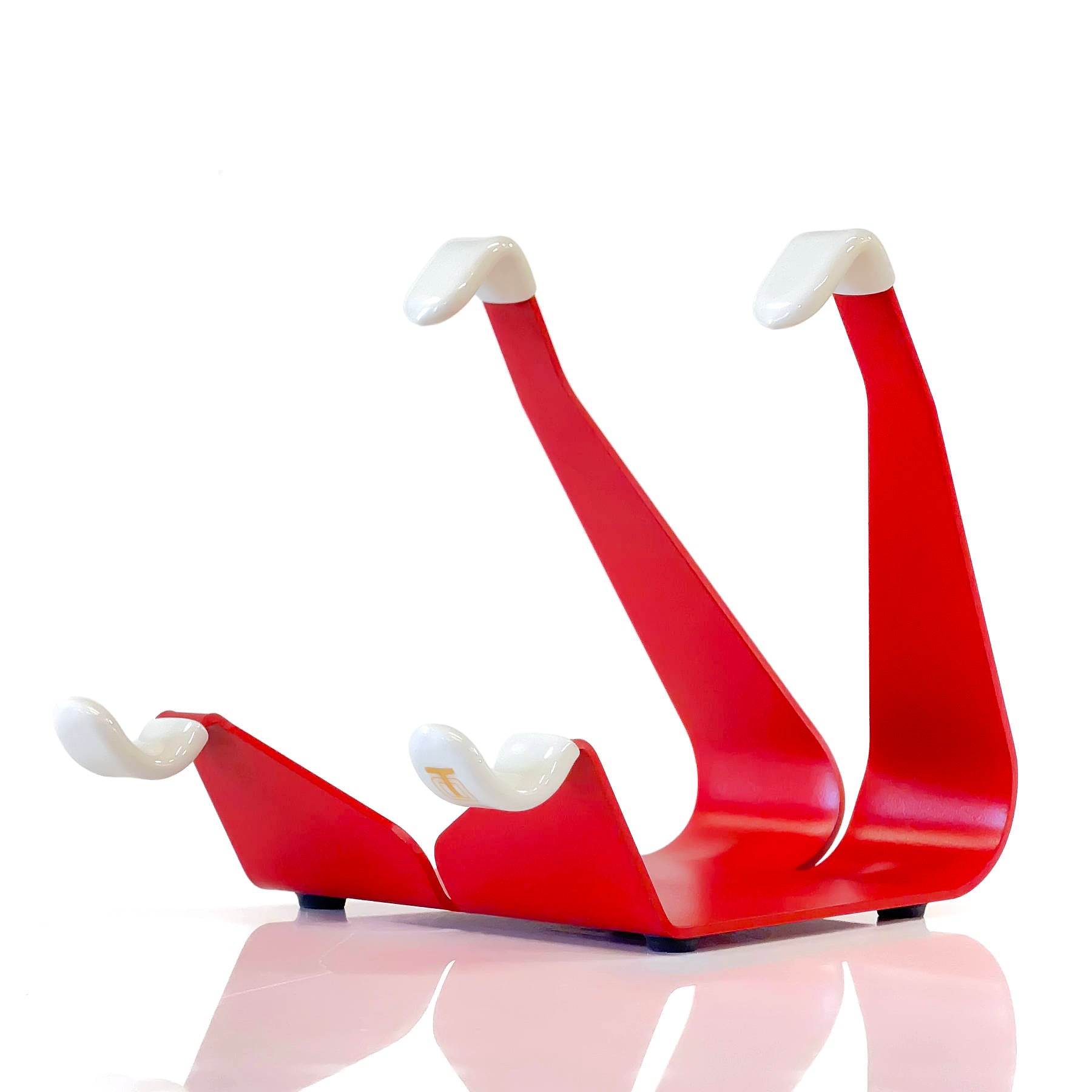 Red compact fixed-angle iPad stand with white top grips and cradle arms