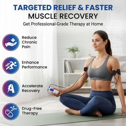 Wired TENS+EMS therapy device with black gel pads on upper arm, held during use