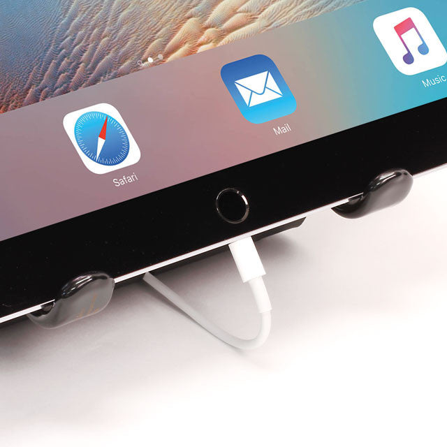 Close-up of fixed-angle tablet stand with silver base and secure cradle grips