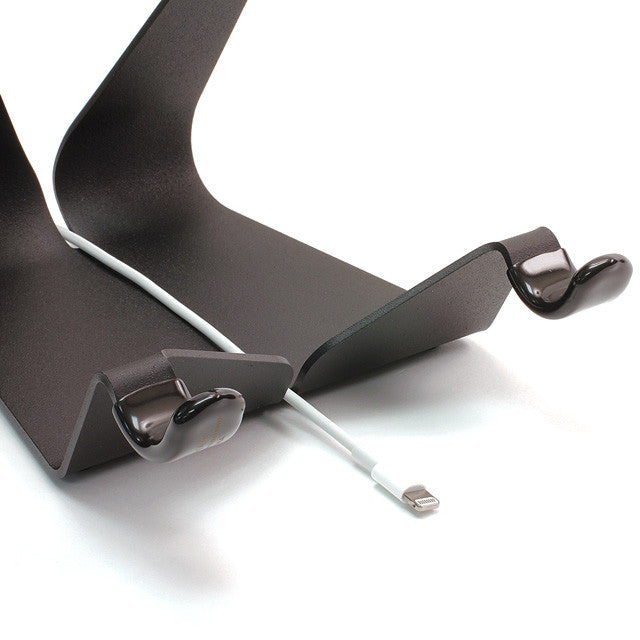 Compact fixed-angle iPad stand with dark matte frame and grip clips