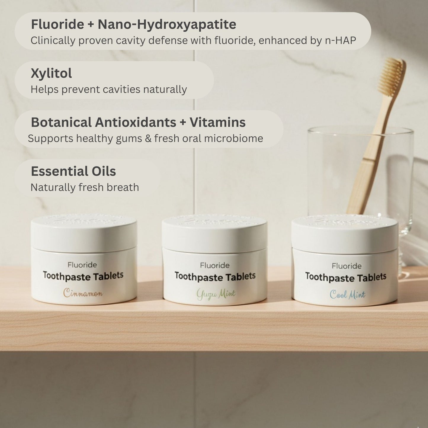 Three fluoride toothpaste tablet jars with toothbrush and mint flavor labels