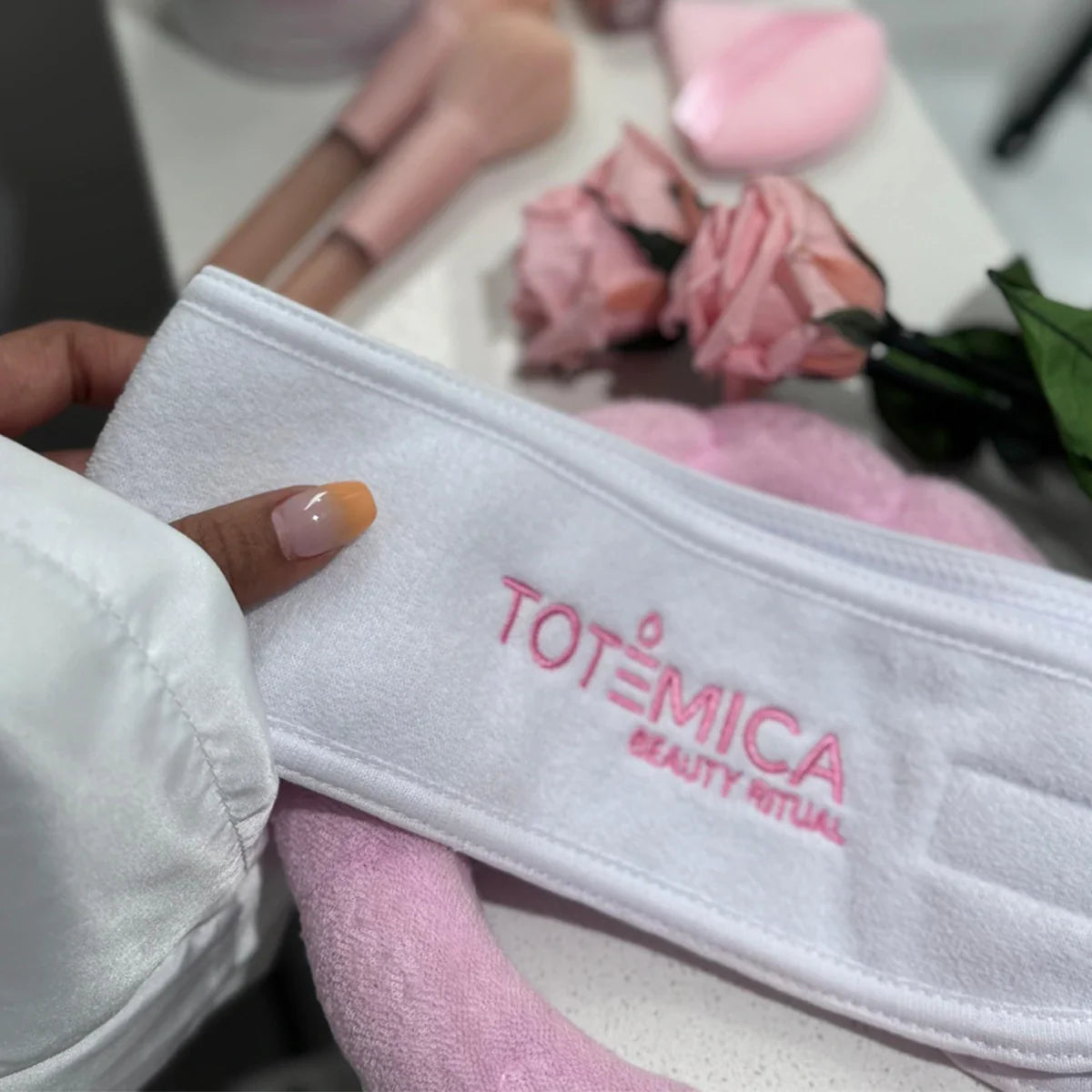 Light gray spa headband with Totemica logo, terry fabric, adjustable band