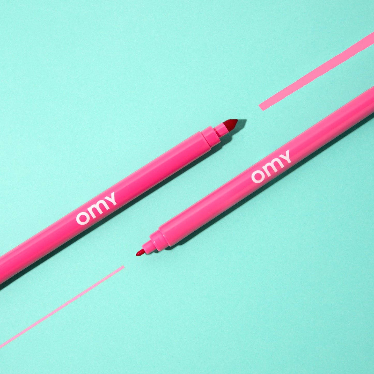 Two pink ultra-washable marker pens with black chisel tips