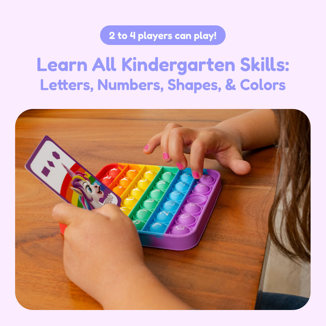 Children playing with a rainbow pop-it letter and number tray and unicorn picture cards