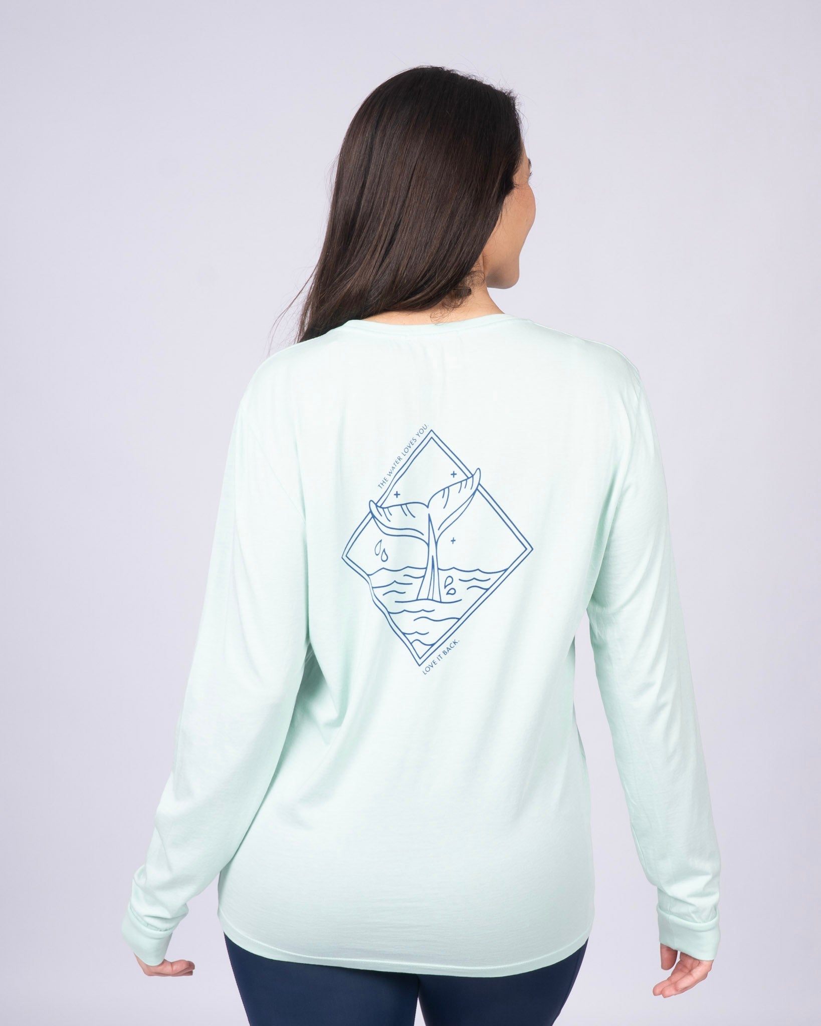 Mint unisex long-sleeve T-shirt with small blue whale logo on back
