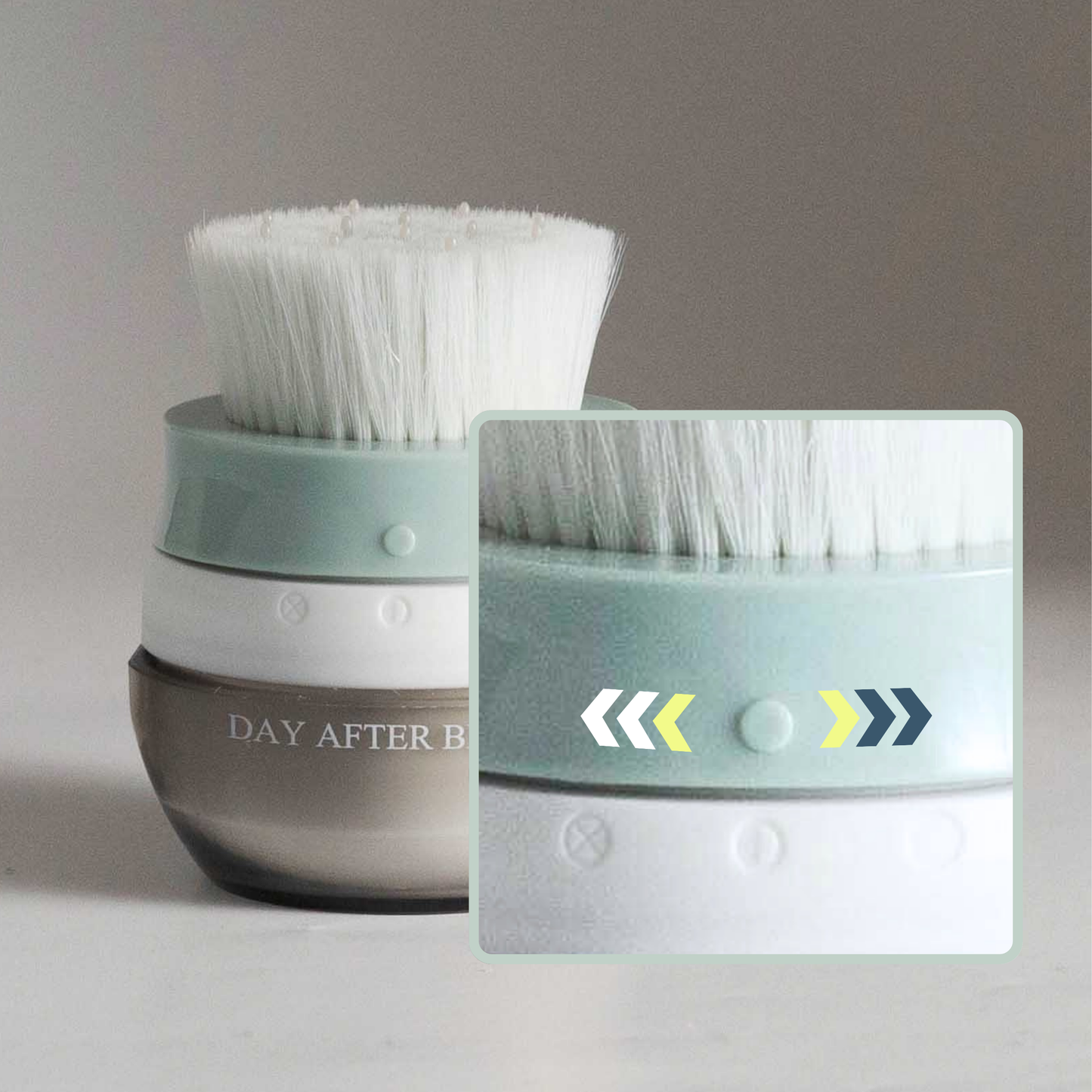 Hair brush with white bristles on teal top over a clear brown jar