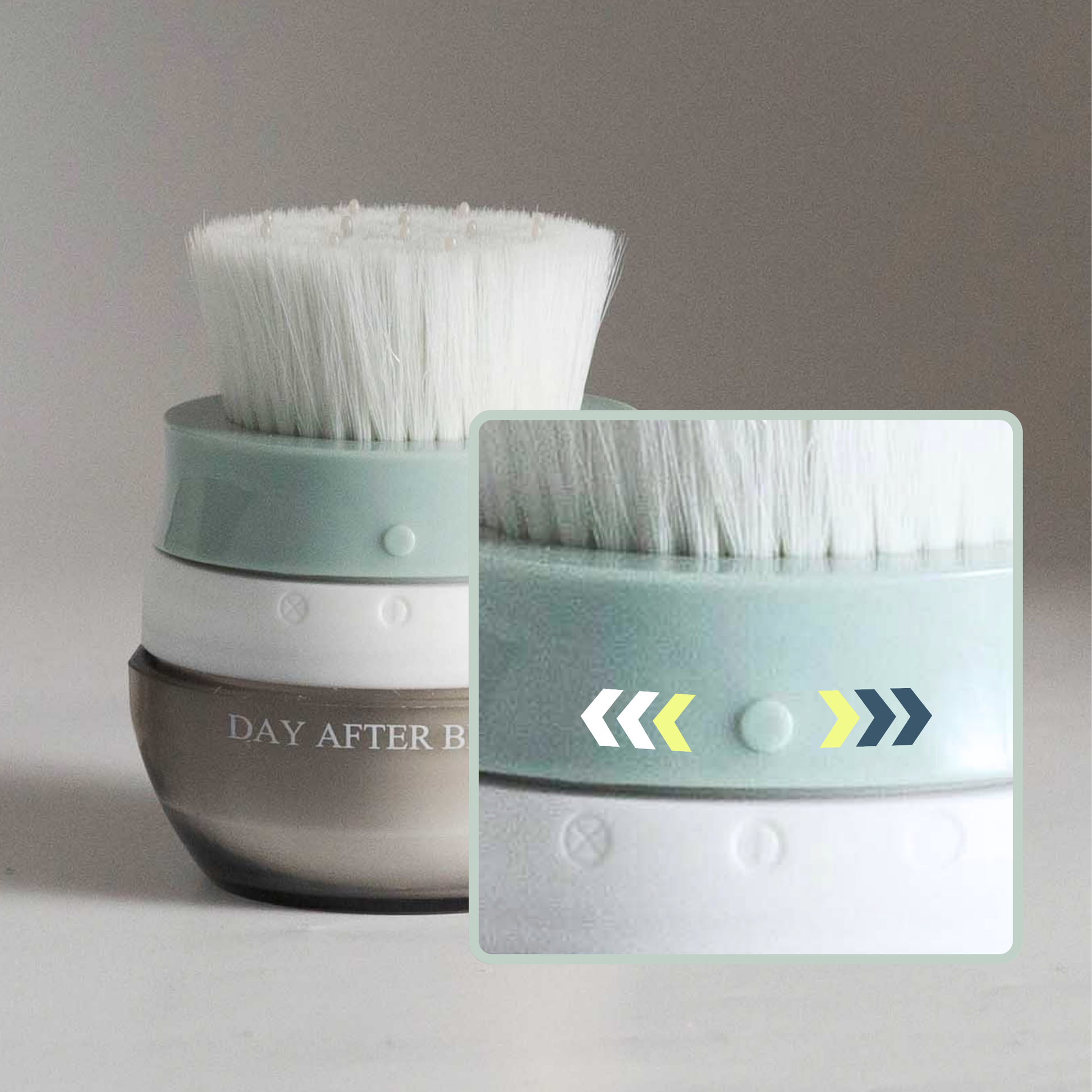 Hair brush with white bristles on teal top over a clear brown jar