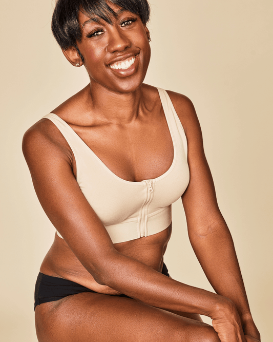 Beige cotton bralette with front zipper closure and wide underband, scoop neckline