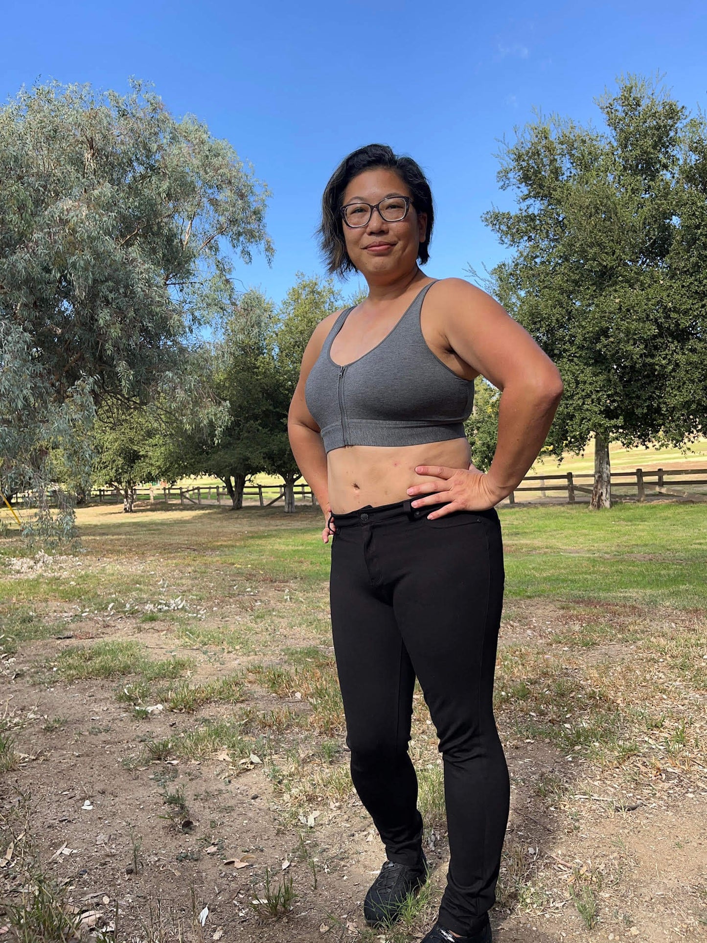 Grey cotton bralette worn with long straps and front zipper closure