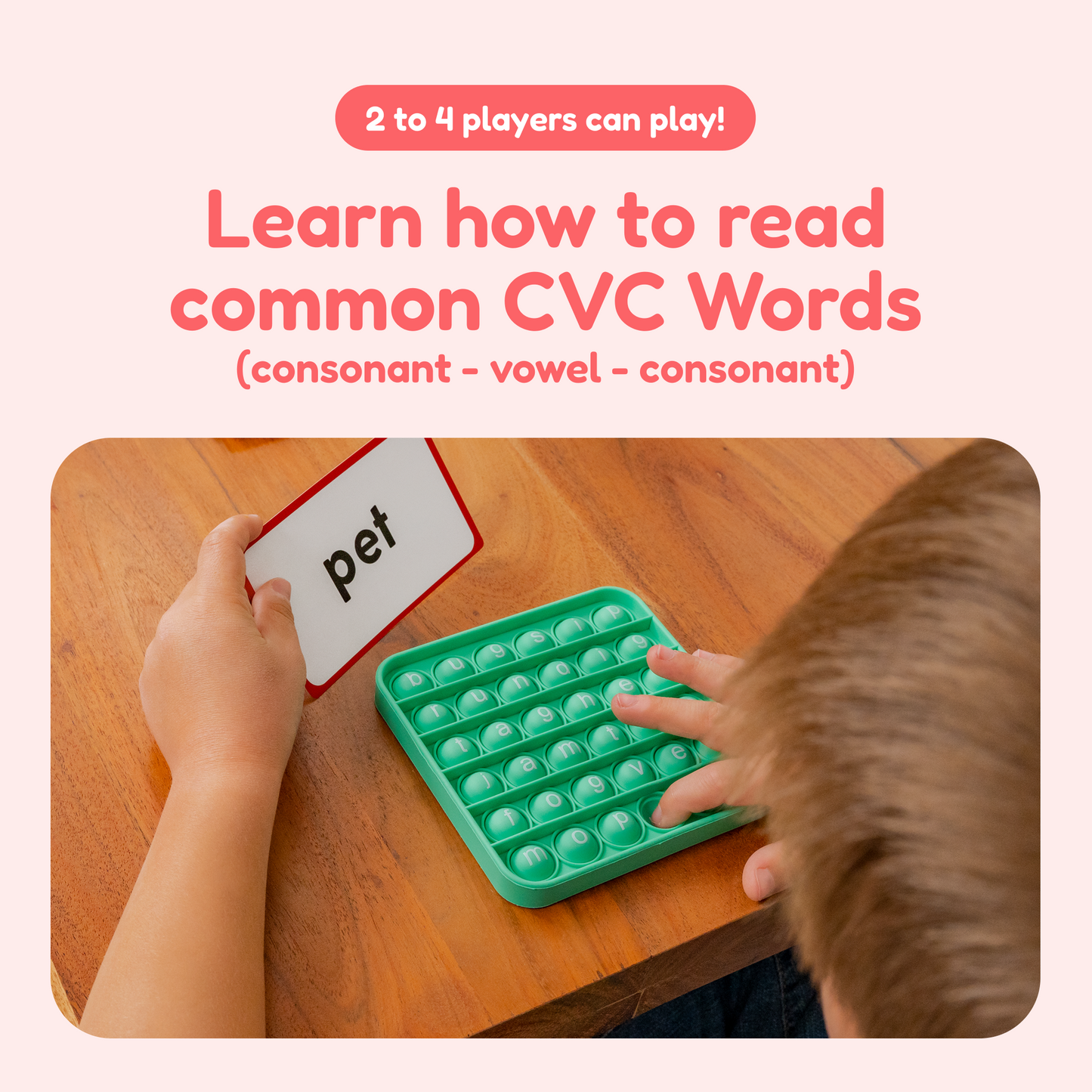 Green letter popit fidget mat with a CVC word card held above a tabletop